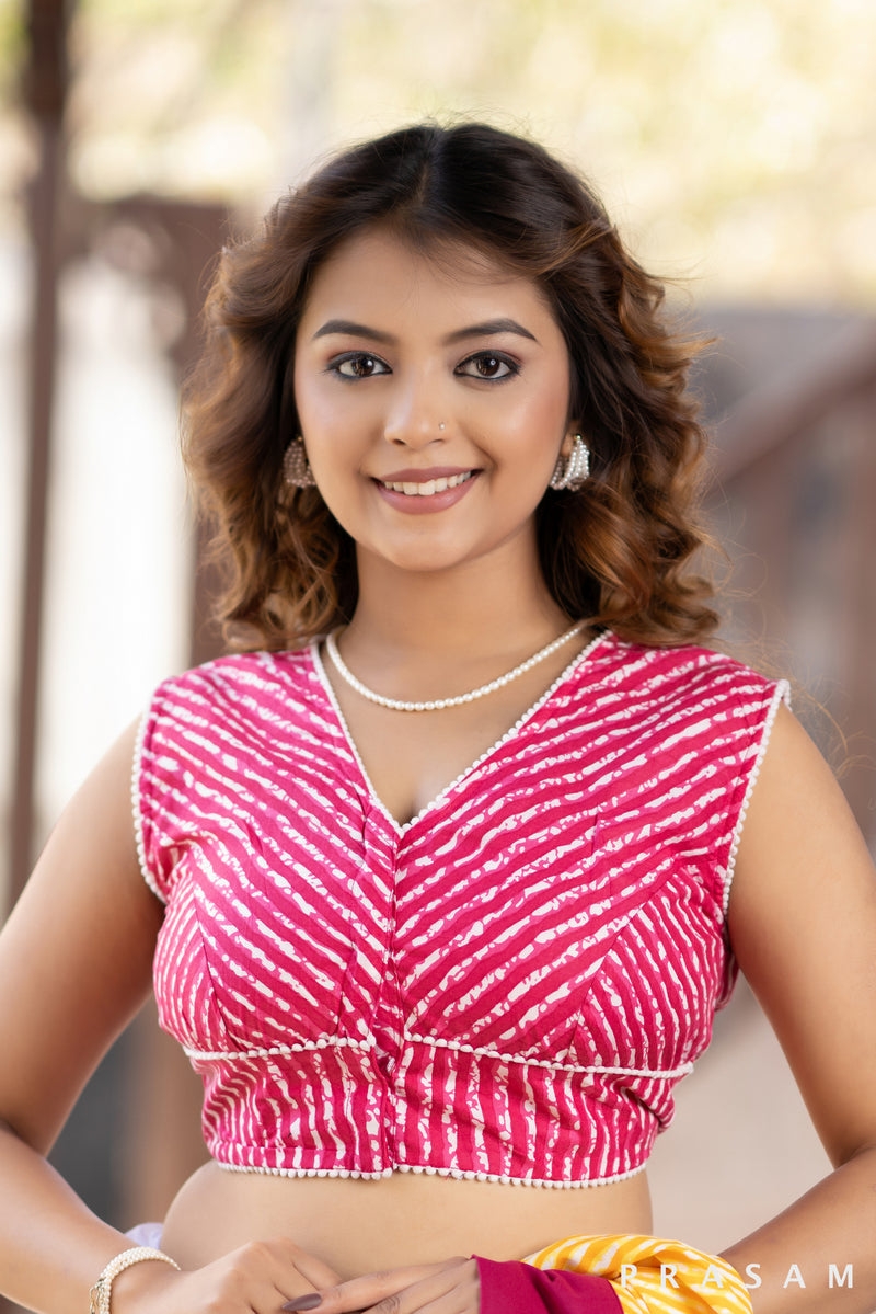 Rani pink sleeveless leheriya blouse with lace trim