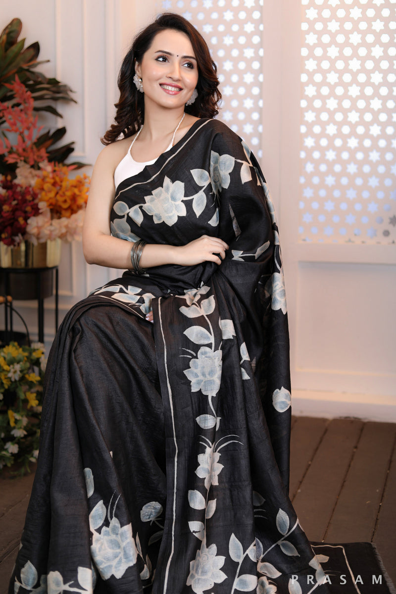 Floral Fantasy Highly sophisticated black silk handpainted saree with floral motifs