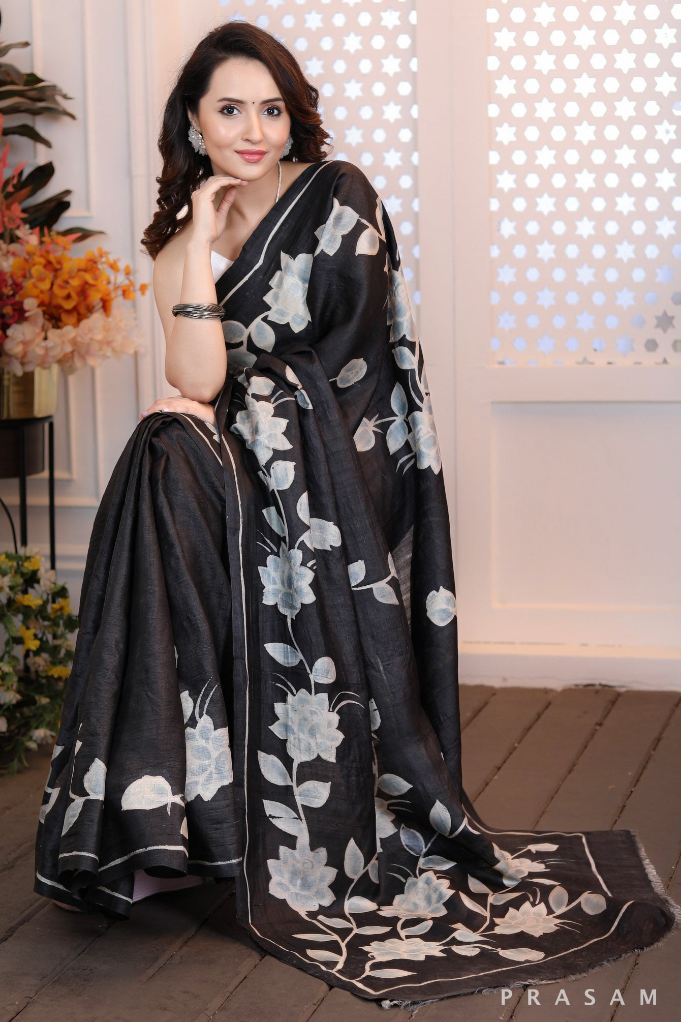 Floral Fantasy Highly sophisticated black silk handpainted saree with floral motifs