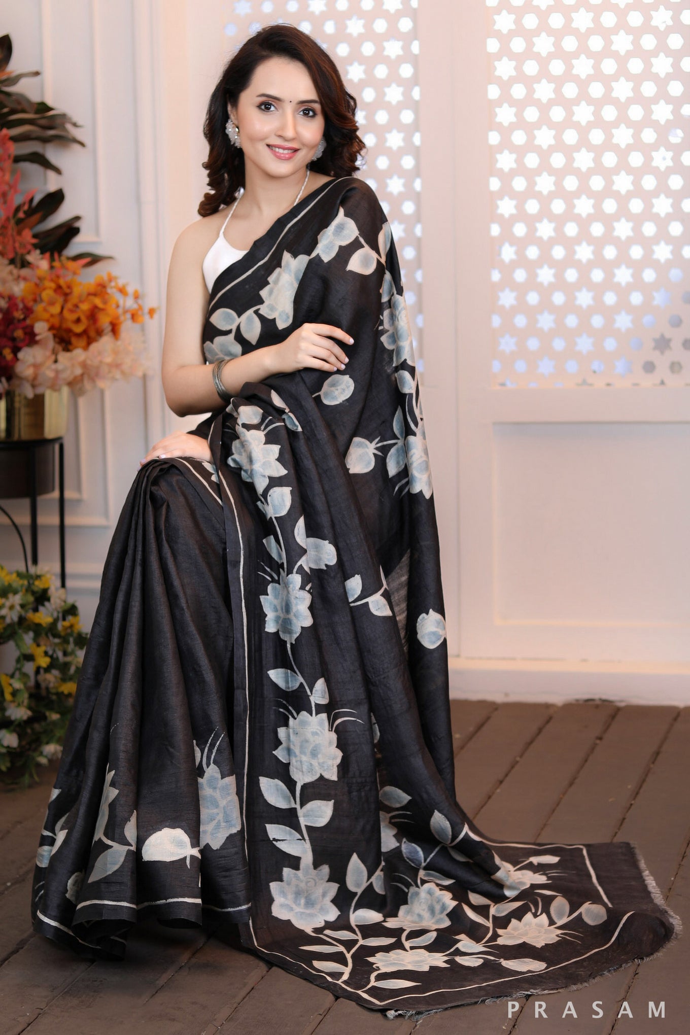 Floral Fantasy Highly sophisticated black silk handpainted saree with floral motifs