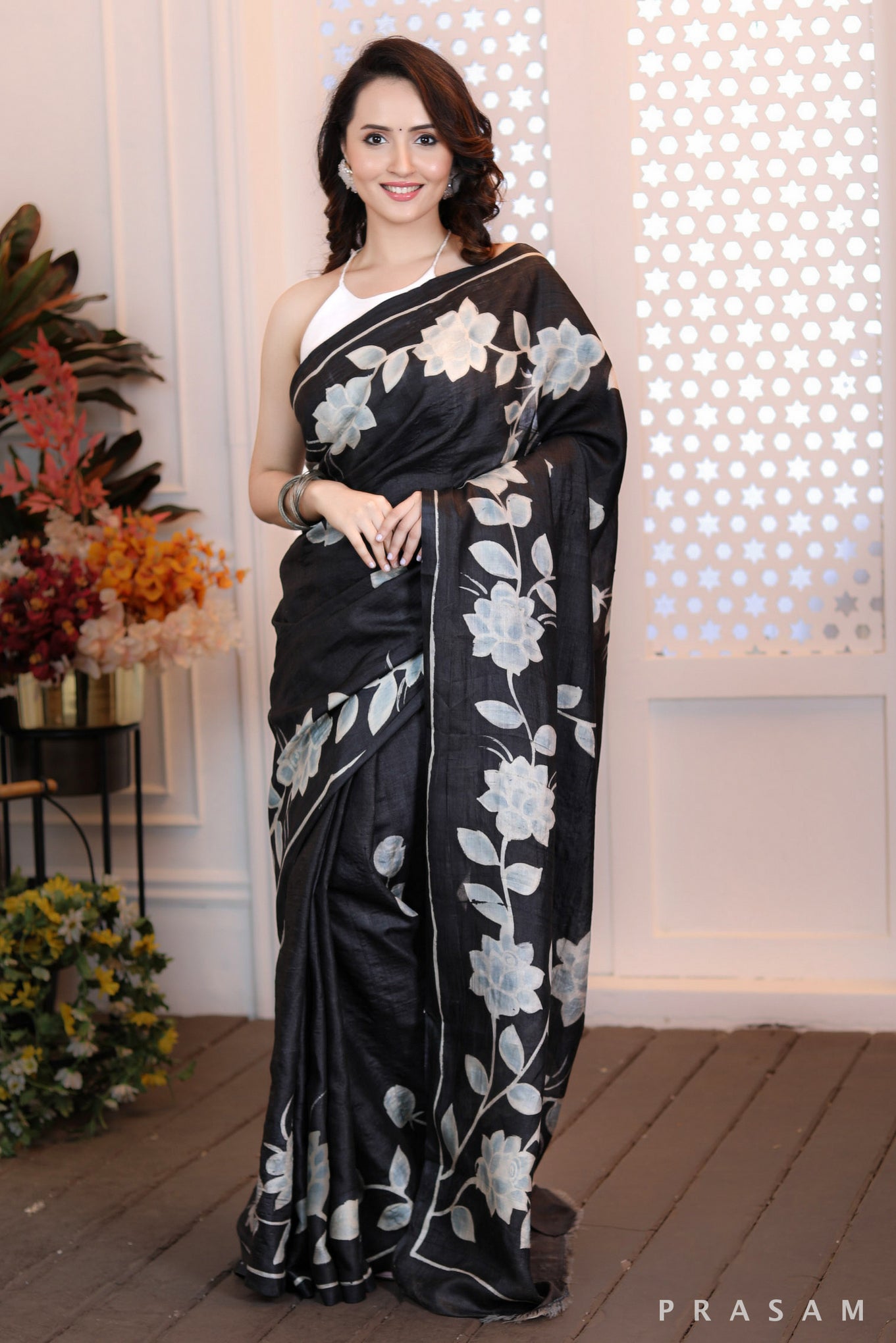 Floral Fantasy Highly sophisticated black silk handpainted saree with floral motifs