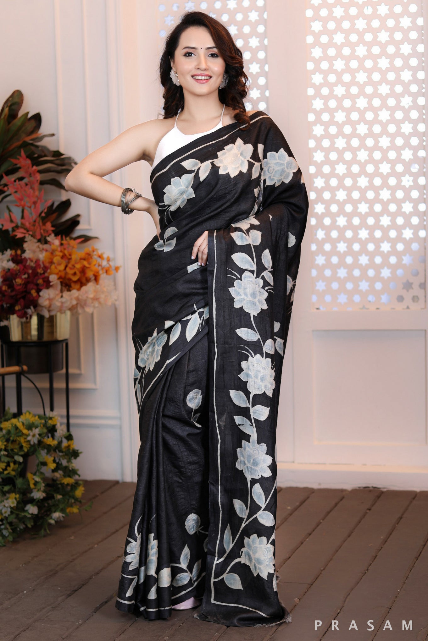 Floral Fantasy Highly sophisticated black silk handpainted saree with floral motifs