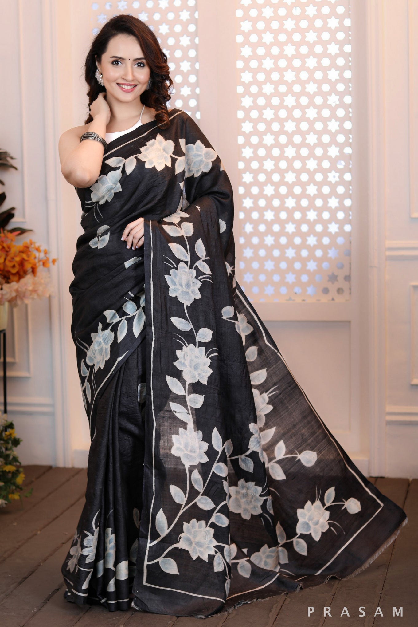 Floral Fantasy Highly sophisticated black silk handpainted saree with floral motifs