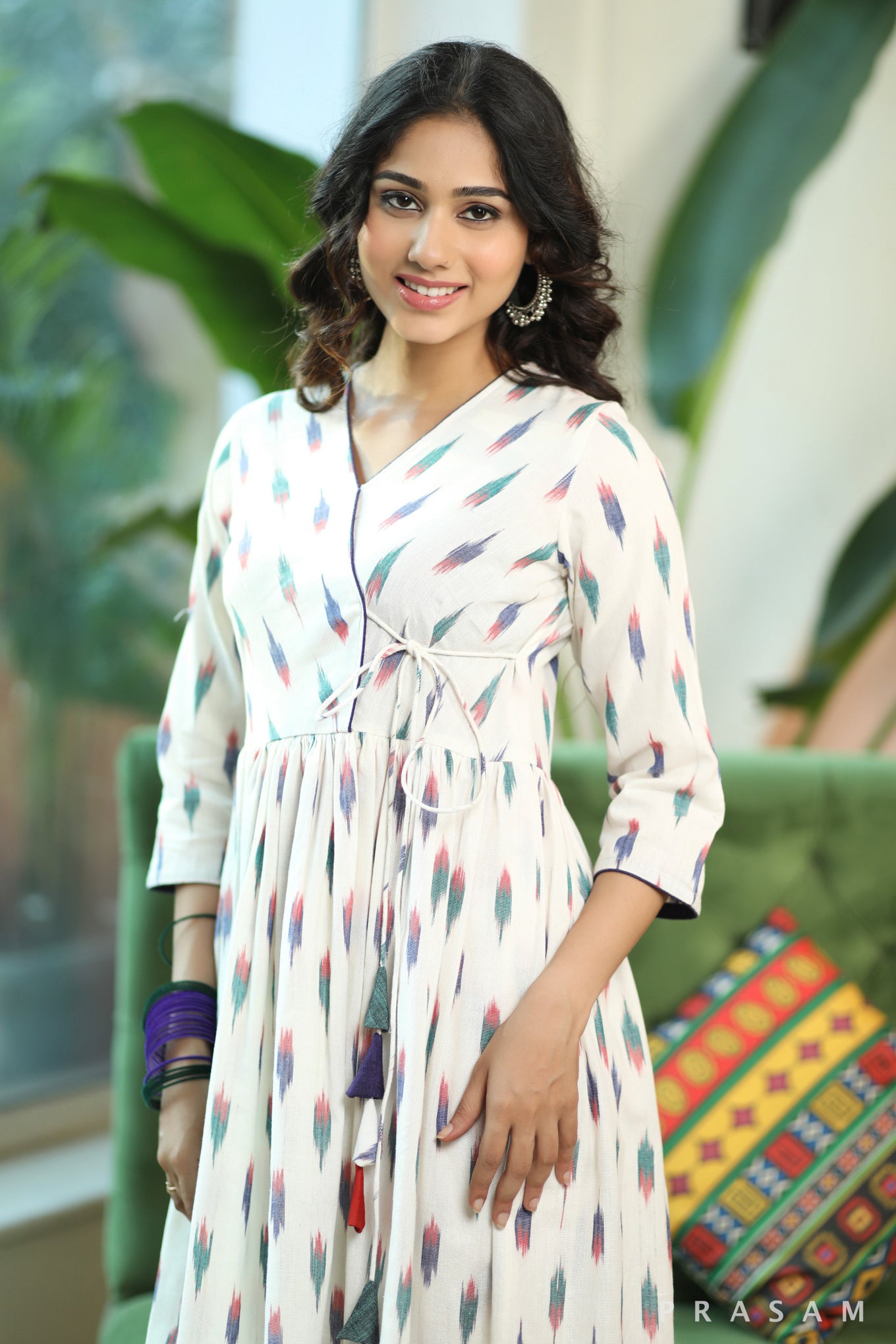 Vibrant Ikat Weaves Smart White And Colorful Ikat Angrakha Style Kurta Set