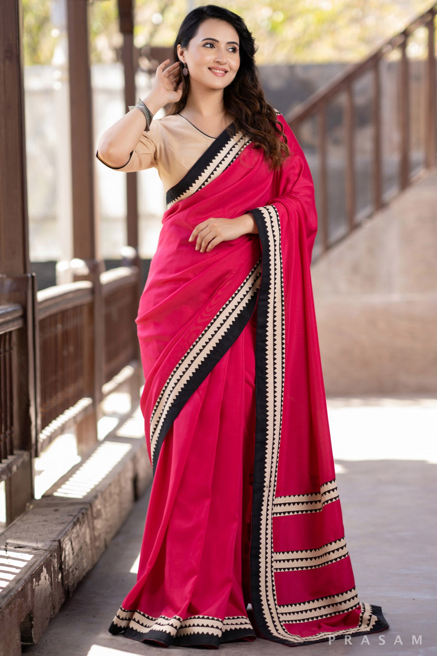 Blossom Rani pink muslin saree with ajrakh borders