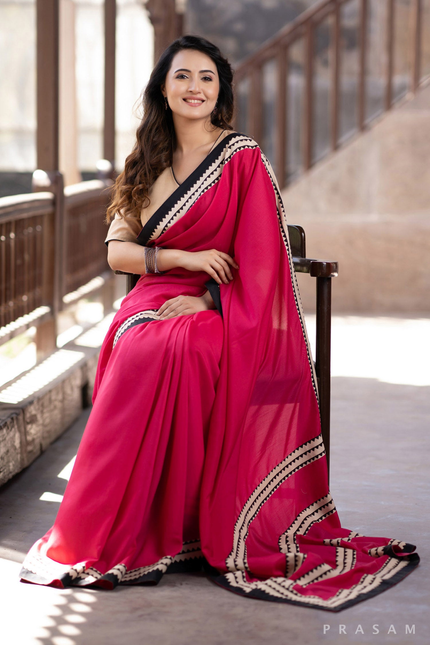 Blossom Rani pink muslin saree with ajrakh borders