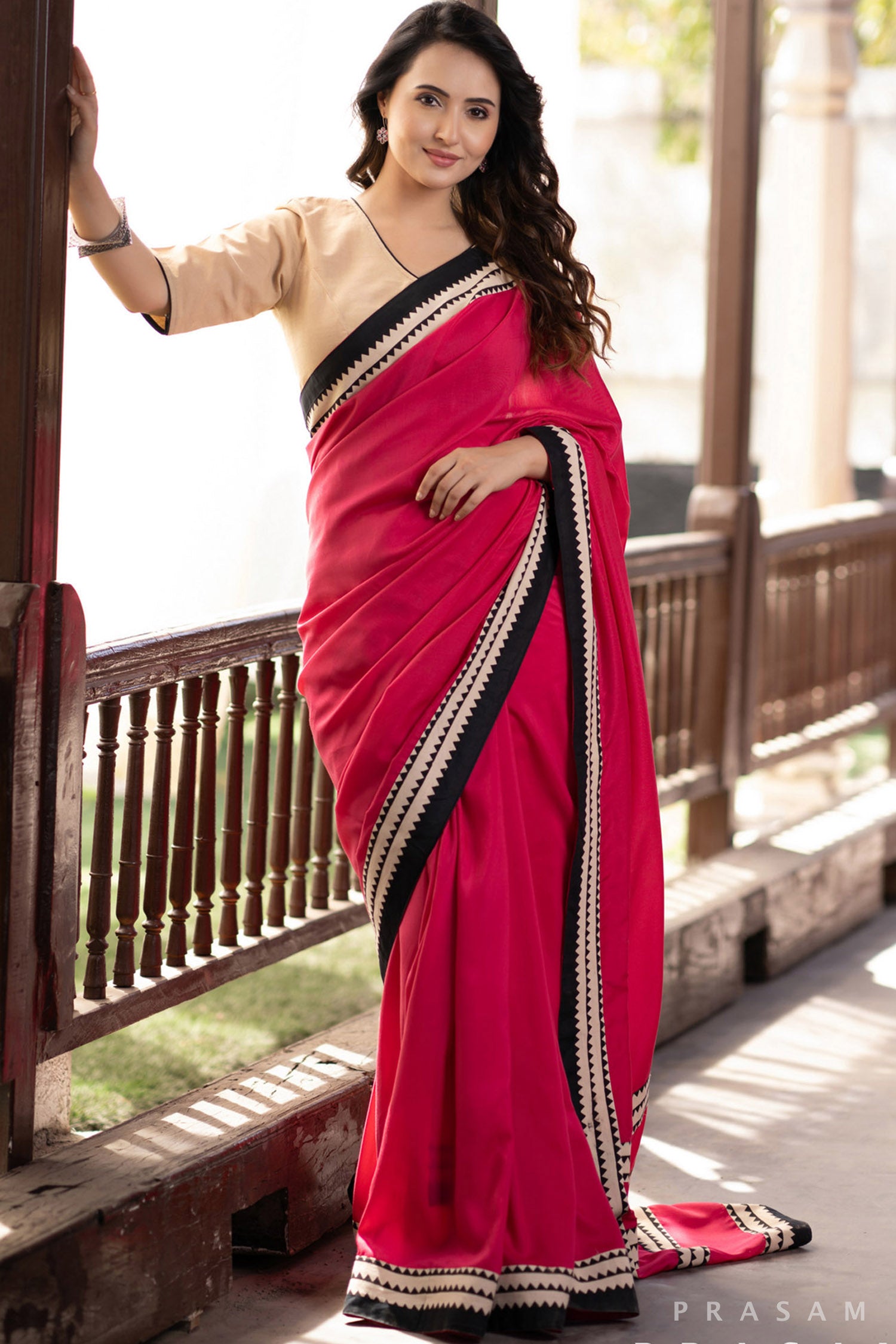 Blossom Rani pink muslin saree with ajrakh borders