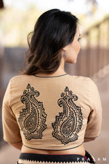 Beige cotton blouse with black trims and block print at the back