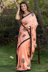 Eleganza Peach muslin saree with block print