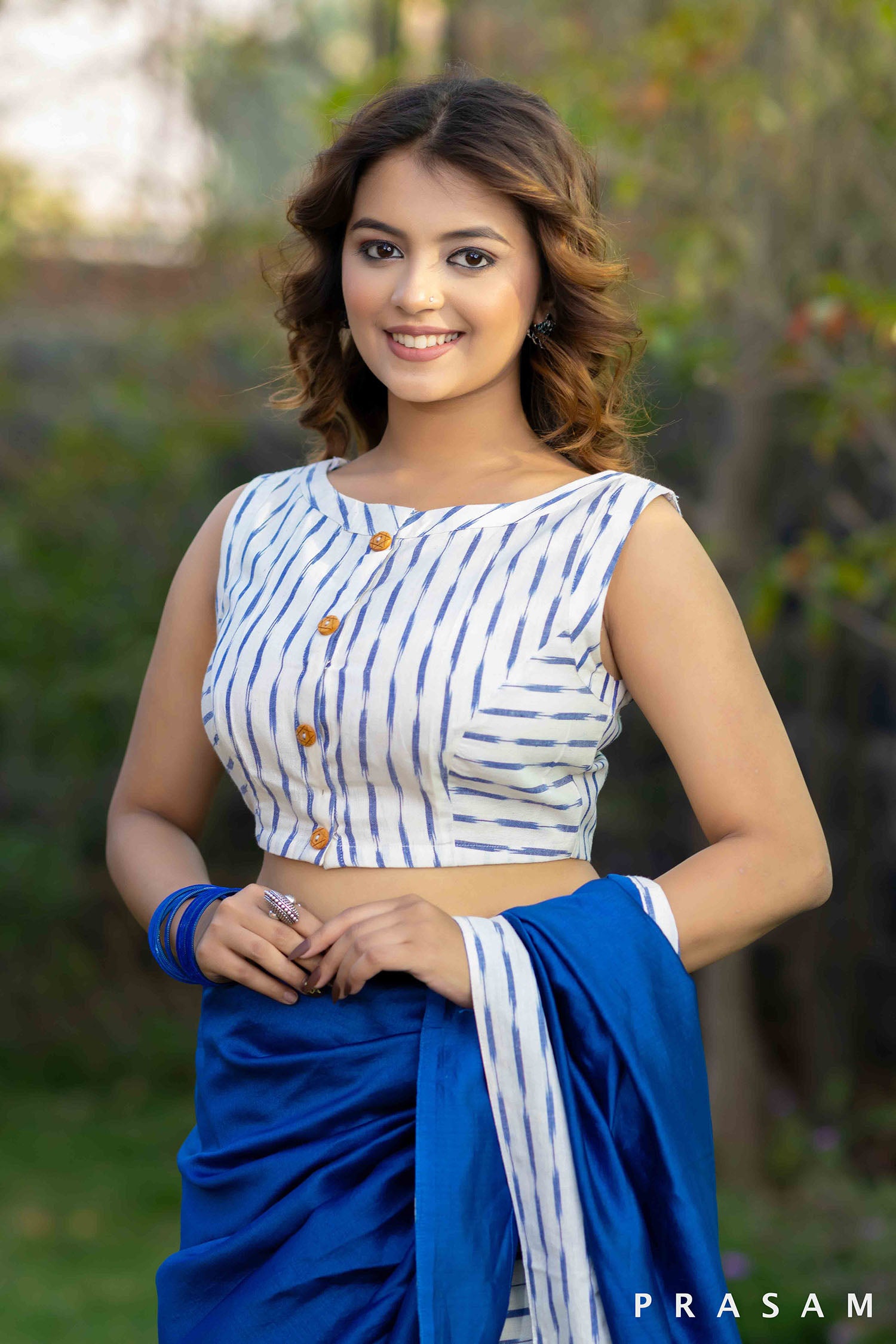 Blue and white handwoven ikat sleeveless blouse with botton details