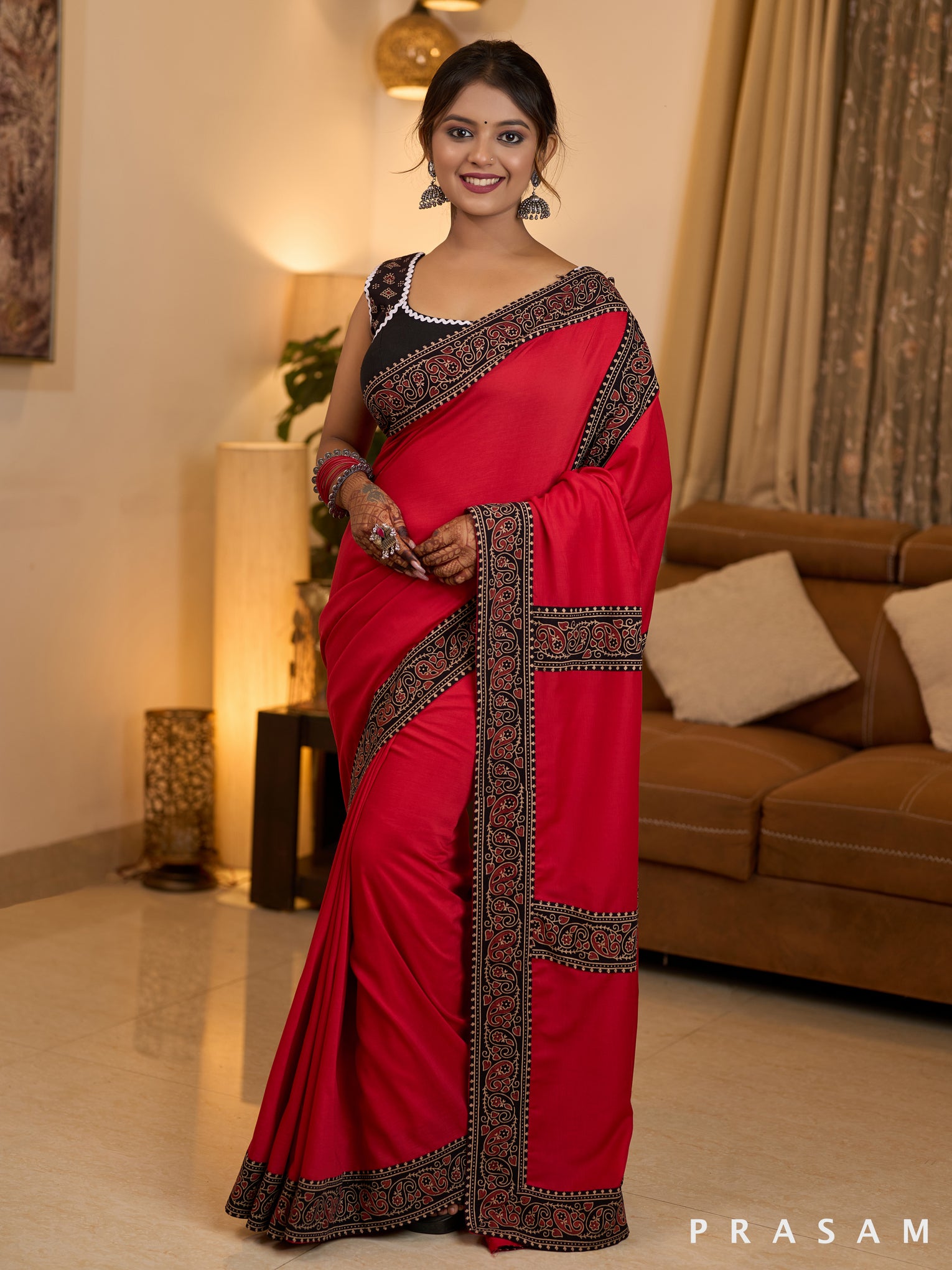 Scarlet Elegance Muslin Saree with Ajrakh Border