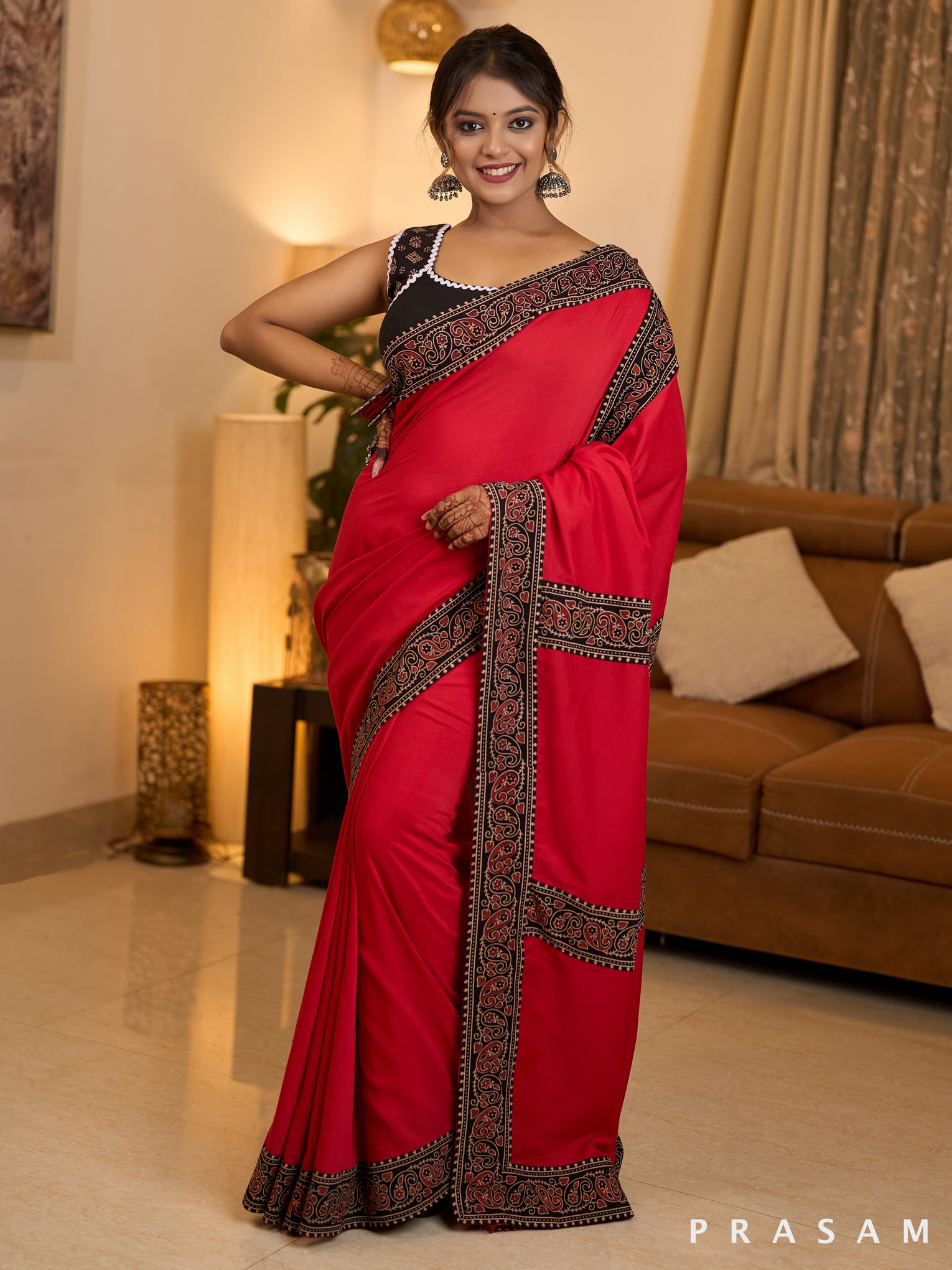 Scarlet Elegance Muslin Saree with Ajrakh Border