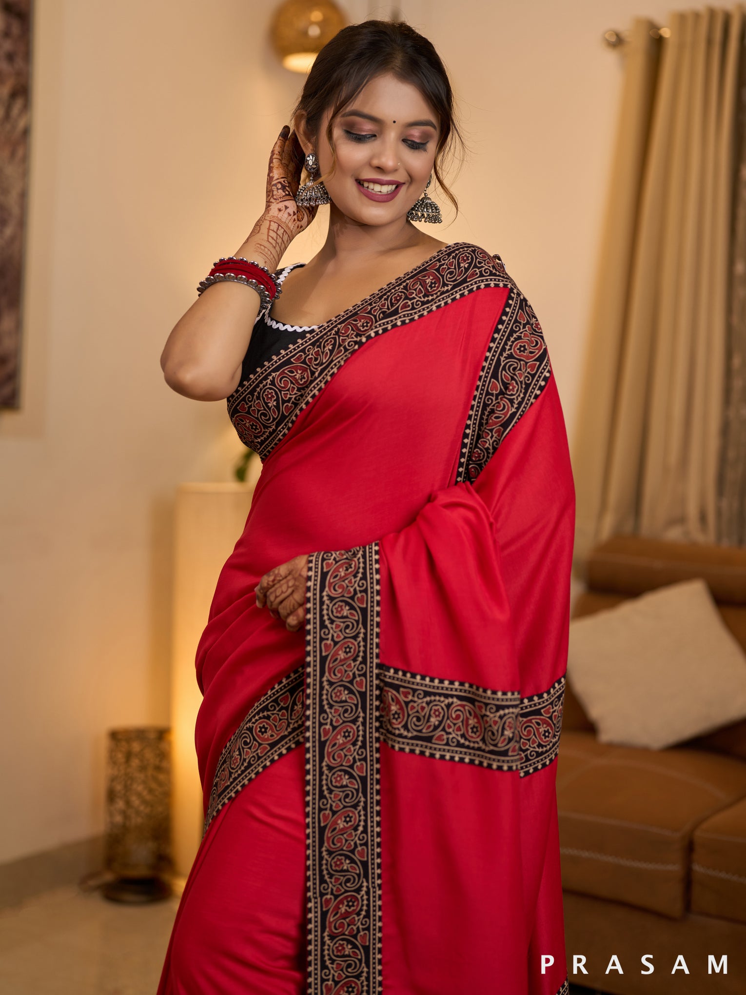 Scarlet Elegance Muslin Saree with Ajrakh Border