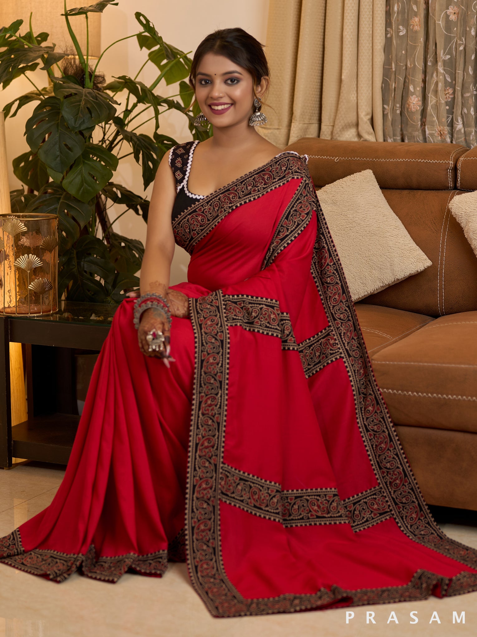 Scarlet Elegance Muslin Saree with Ajrakh Border