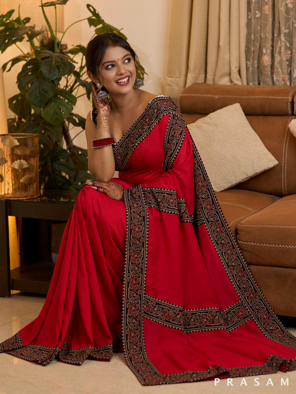 Scarlet Elegance Muslin Saree with Ajrakh Border