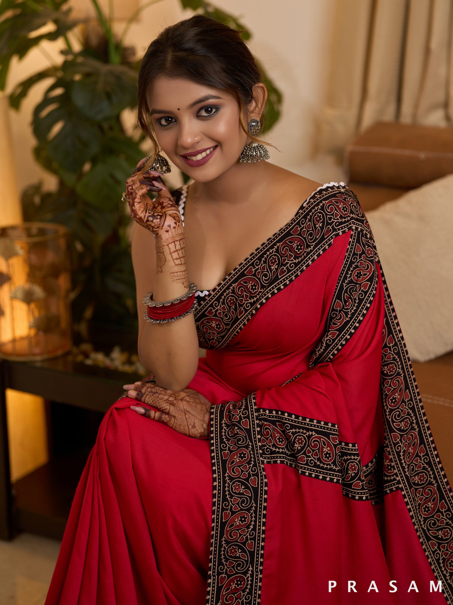 Scarlet Elegance Muslin Saree with Ajrakh Border