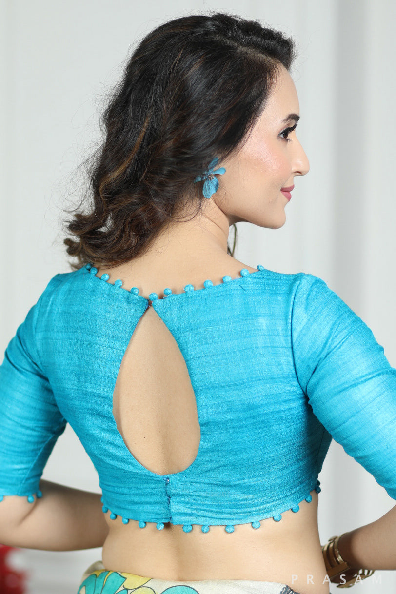 Turquoise Designer Tussar Giccha Handwoven Boat Neck Blouse with beautiful detailing in neck and borders Prasam Crafts