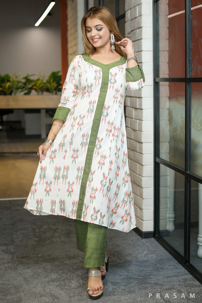 Gulmohar Graceful white ikat kurti with green handloom trims pants optional