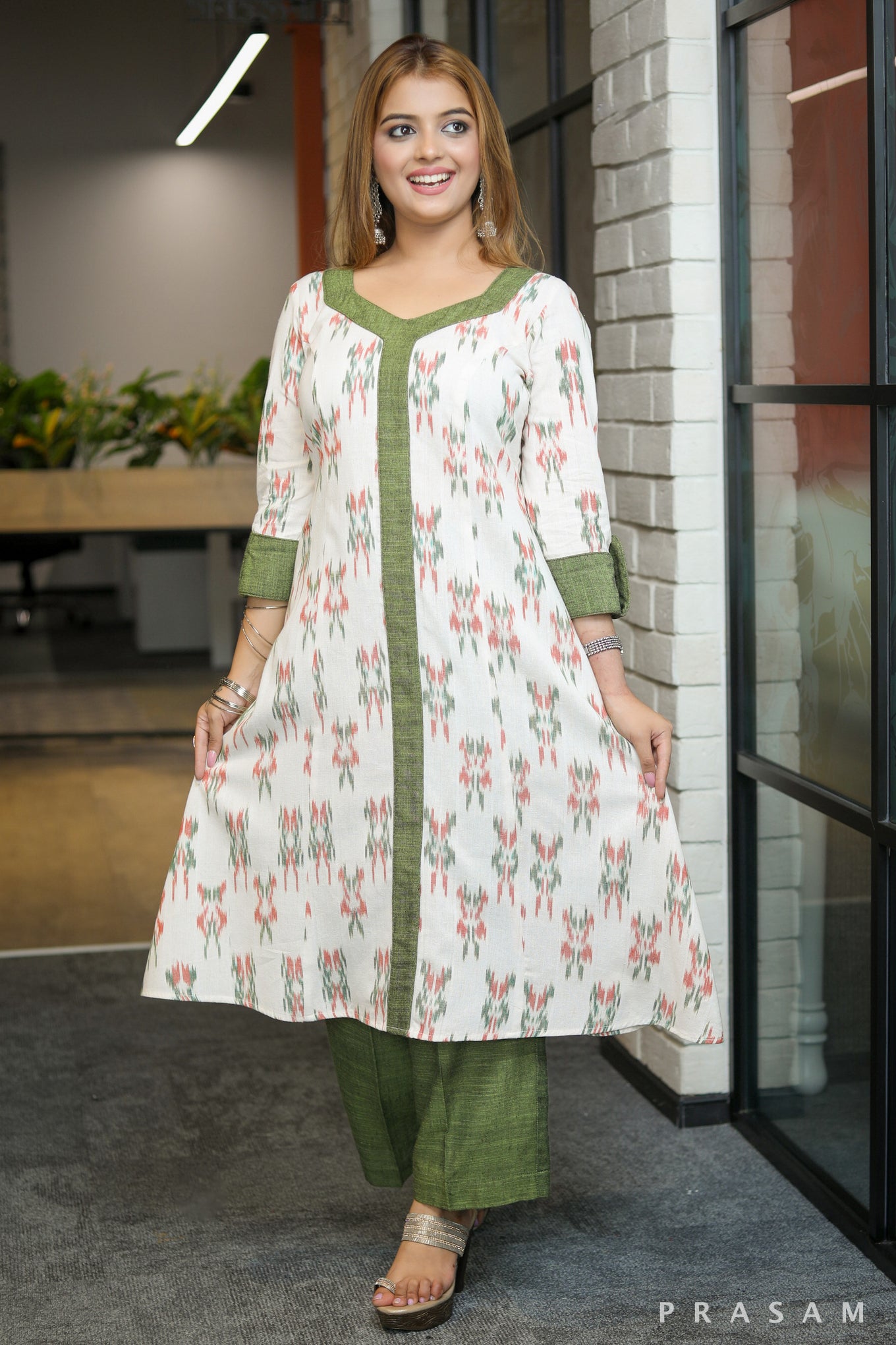 Gulmohar Graceful white ikat kurti with green handloom trims pants optional