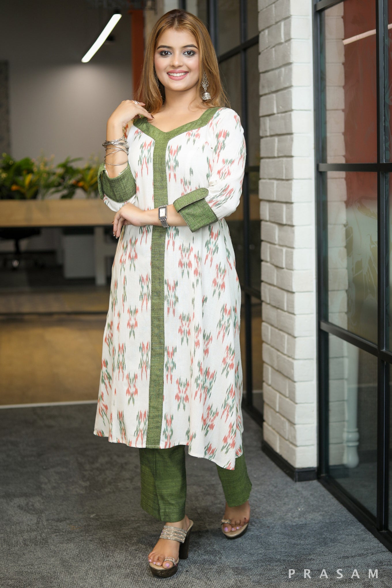 Gulmohar Graceful white ikat kurti with green handloom trims pants optional