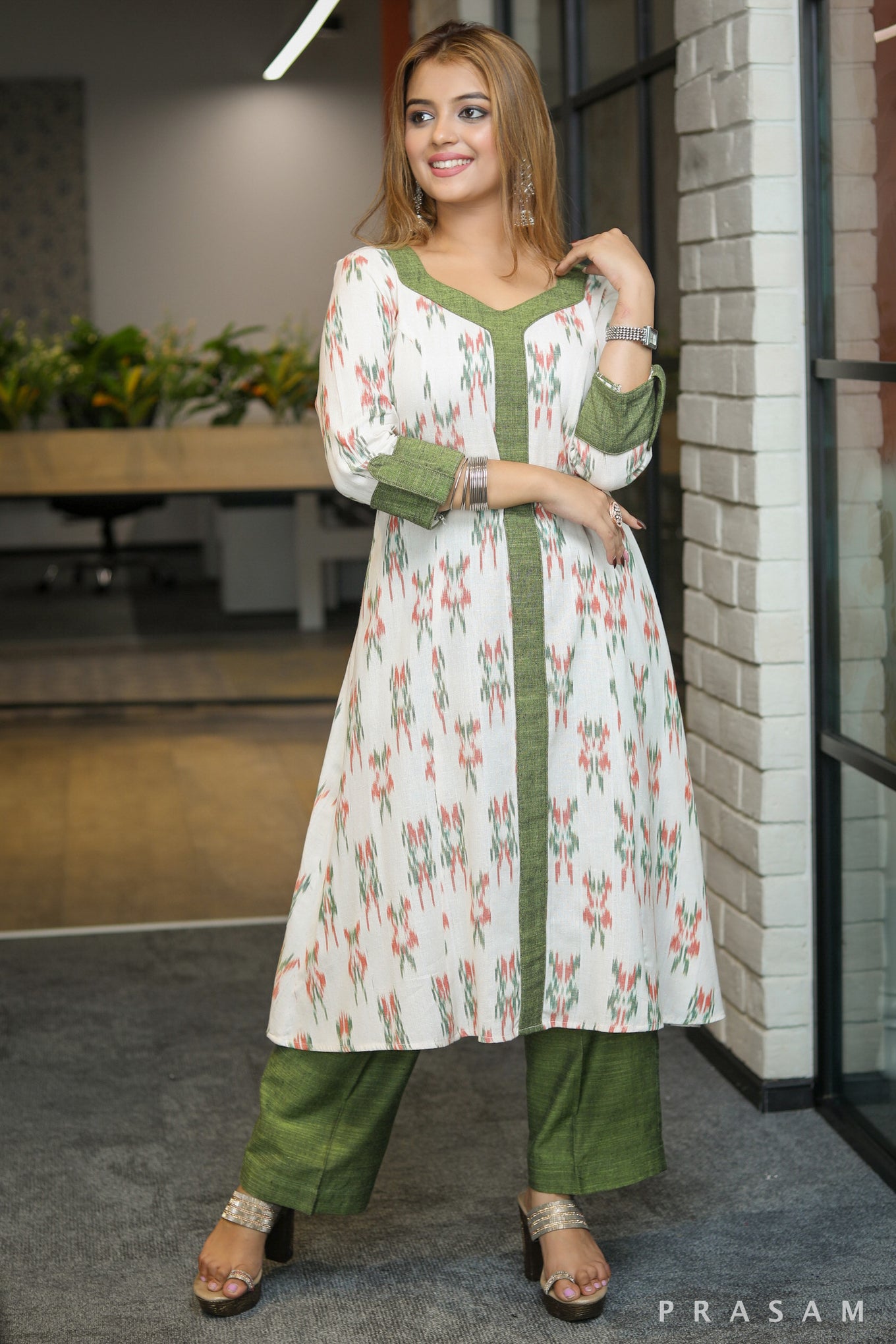 Gulmohar Graceful white ikat kurti with green handloom trims pants optional